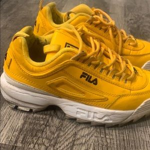 Bright yellow Fila’s